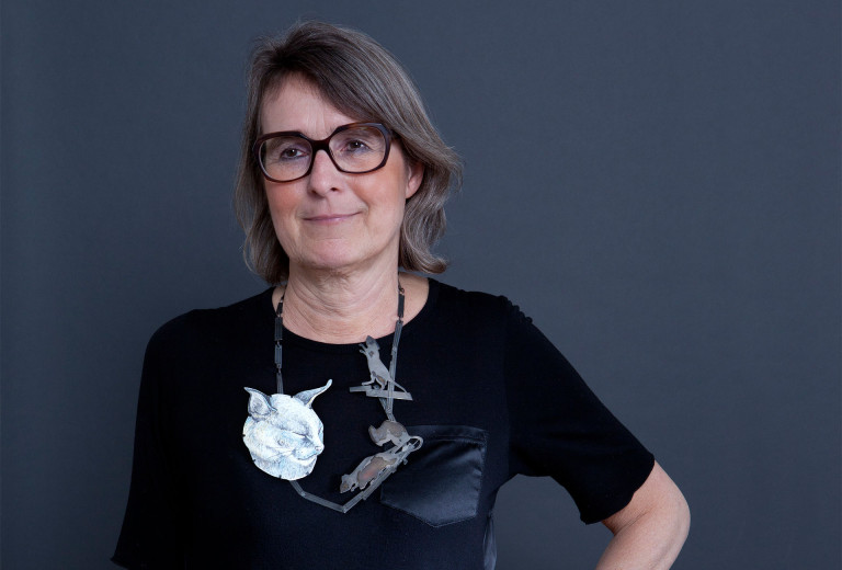 Liesbeth den Besten with necklace <em>Wenn die Mäuse auf dem Tisch tanzen</em> (when mice dance on tables) by Tabea Reulecke, oxidized silver, enamel, copper. Photo Miriam Künzli for Art Aurea.