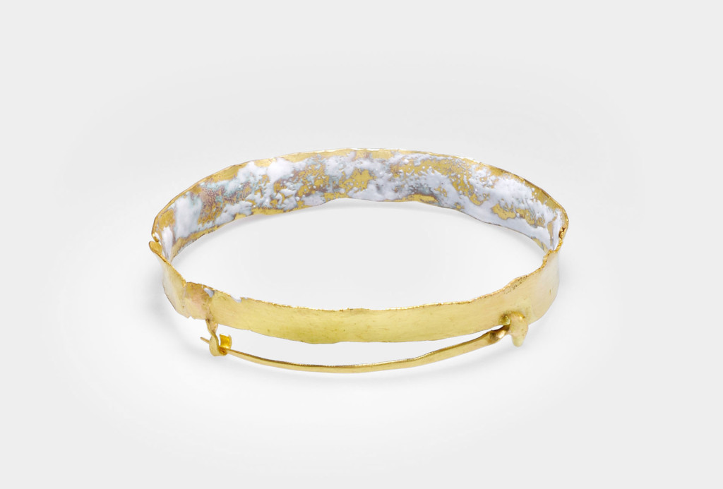 <em>a3</em> brooch. Gold, enamel