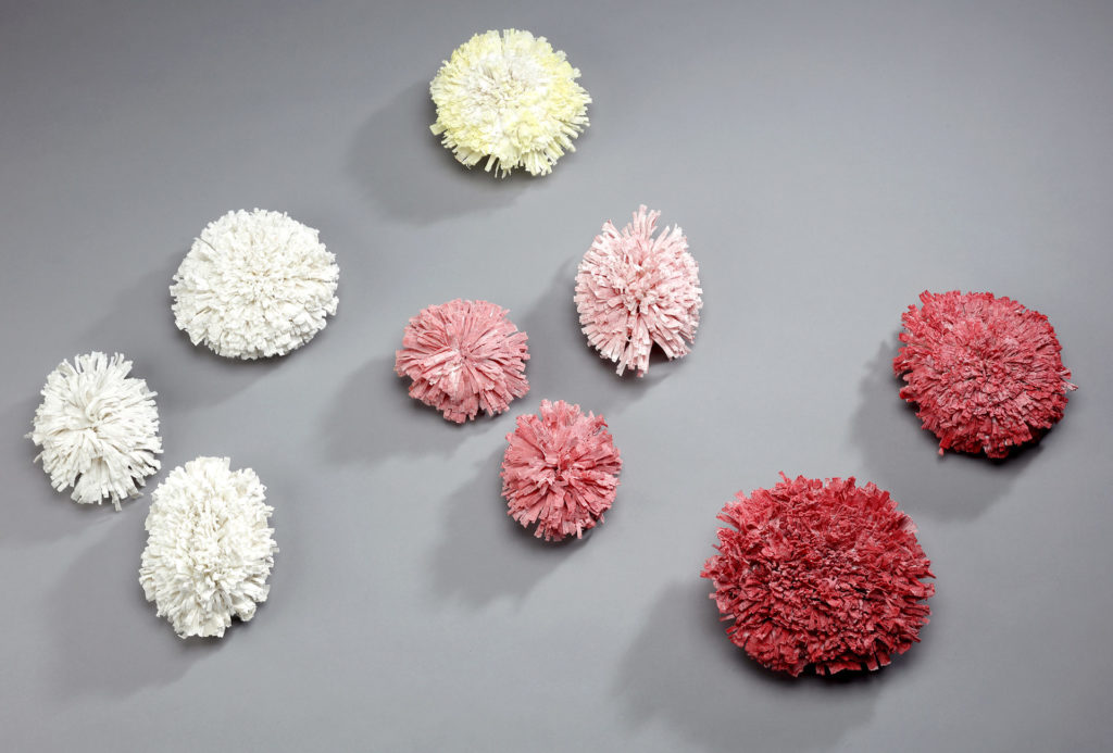 <em>Seenemonen</em> wall object. Porcelain, Ø 8–15 cm. Photo Te-Hsin Chiu.