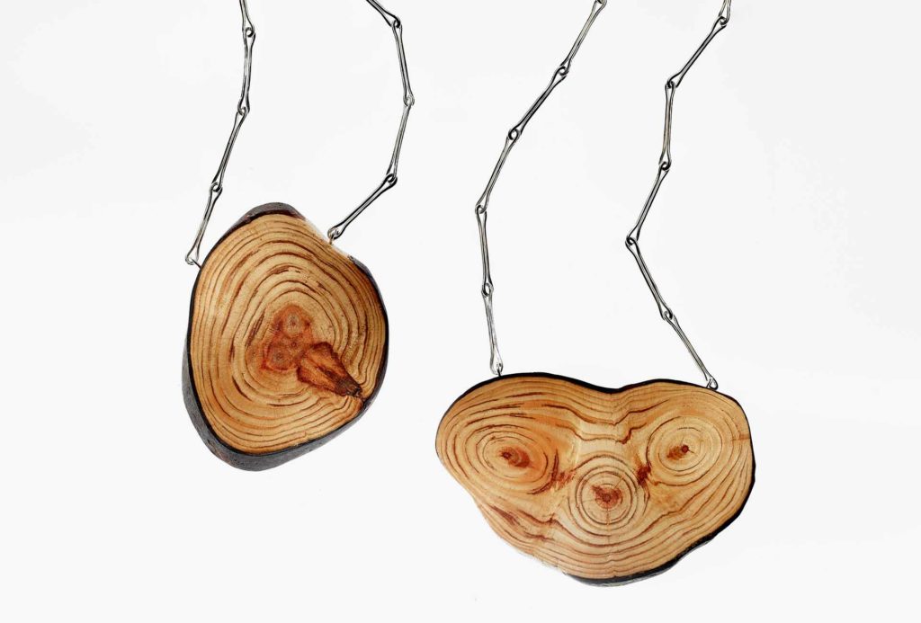<em>Dryade 1</em> pendant, 2017. Silver, pine wood. Photo Sebastian Ahlers.