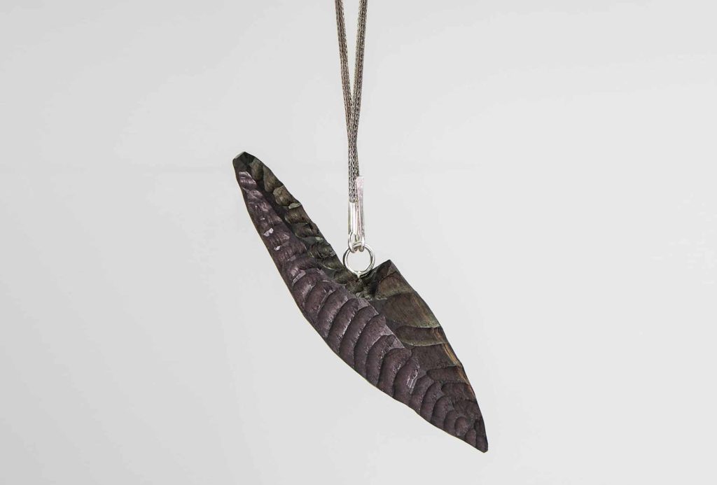 <em>Origin 2</em> pendant, 2018. Silver, ebony. Photo Harald Müller-Dempf.