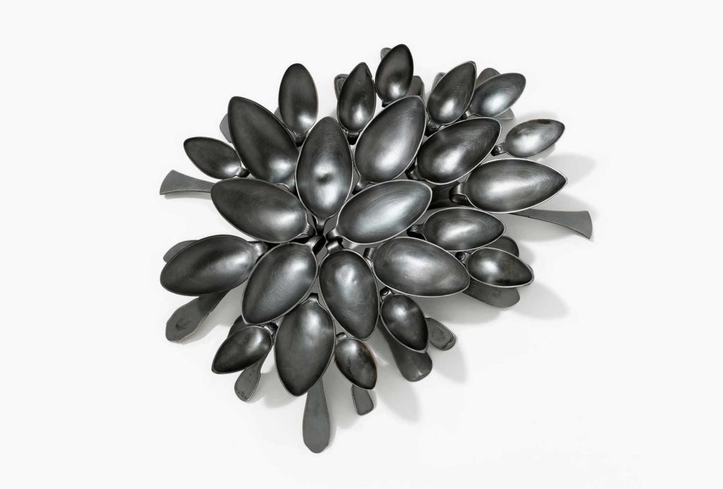 <em>Reunion Black II</em>, 2016. Used silver spoons, silver 800, mounted, blackened. Photo Eva Jünger